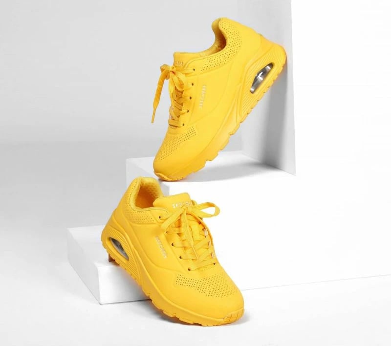 Atlete femra Skechers, të verdha